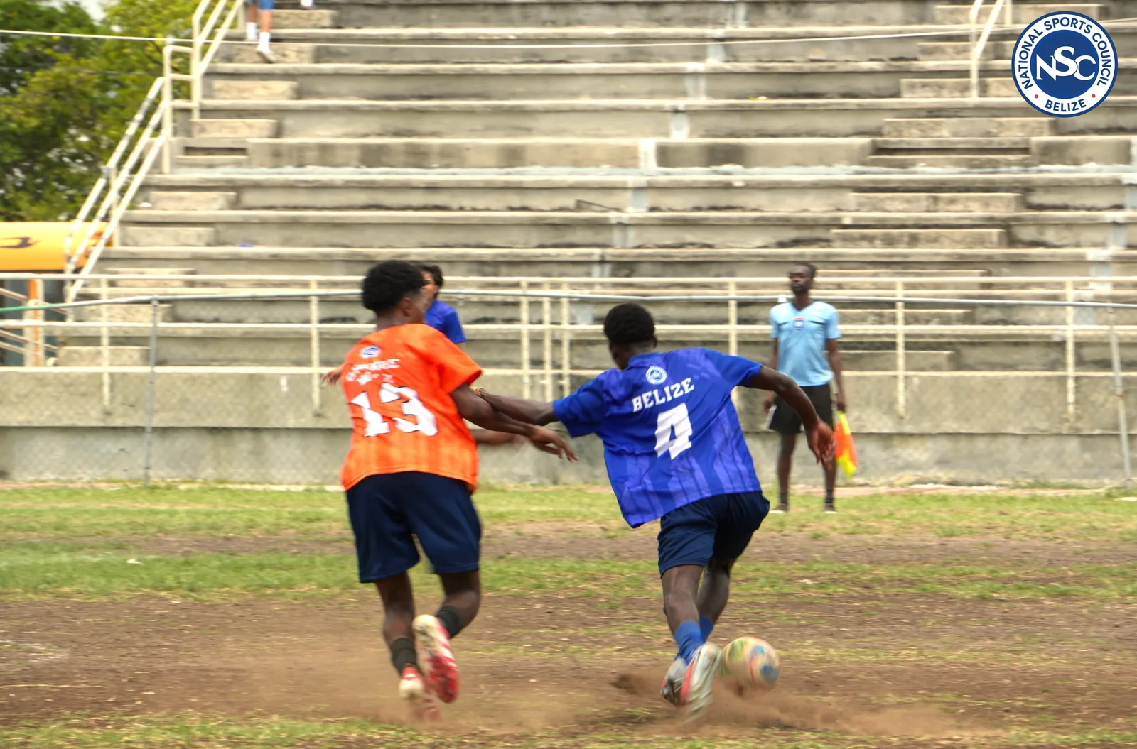 Two youth soccer players challenging for the ball in front of the grandstand at the NSC Super Nationals